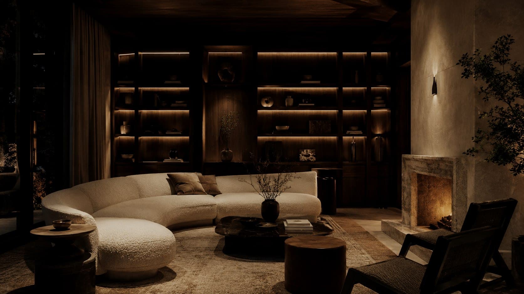 A villa lounge in the evening with a fireplace and layered seating