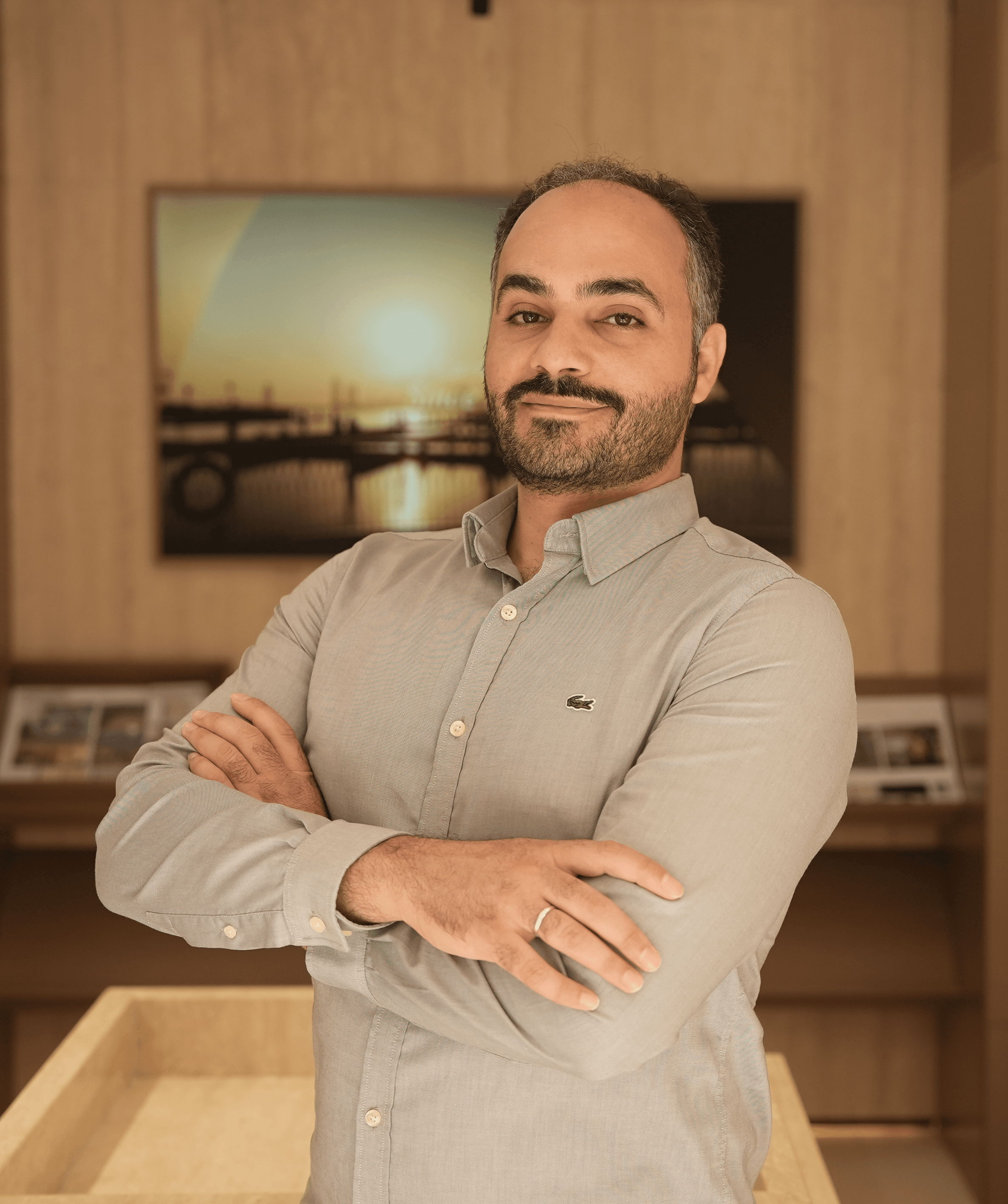 Halit Haşimoğlu, Head of Architecture at LKYOOB, arms folded in the studio