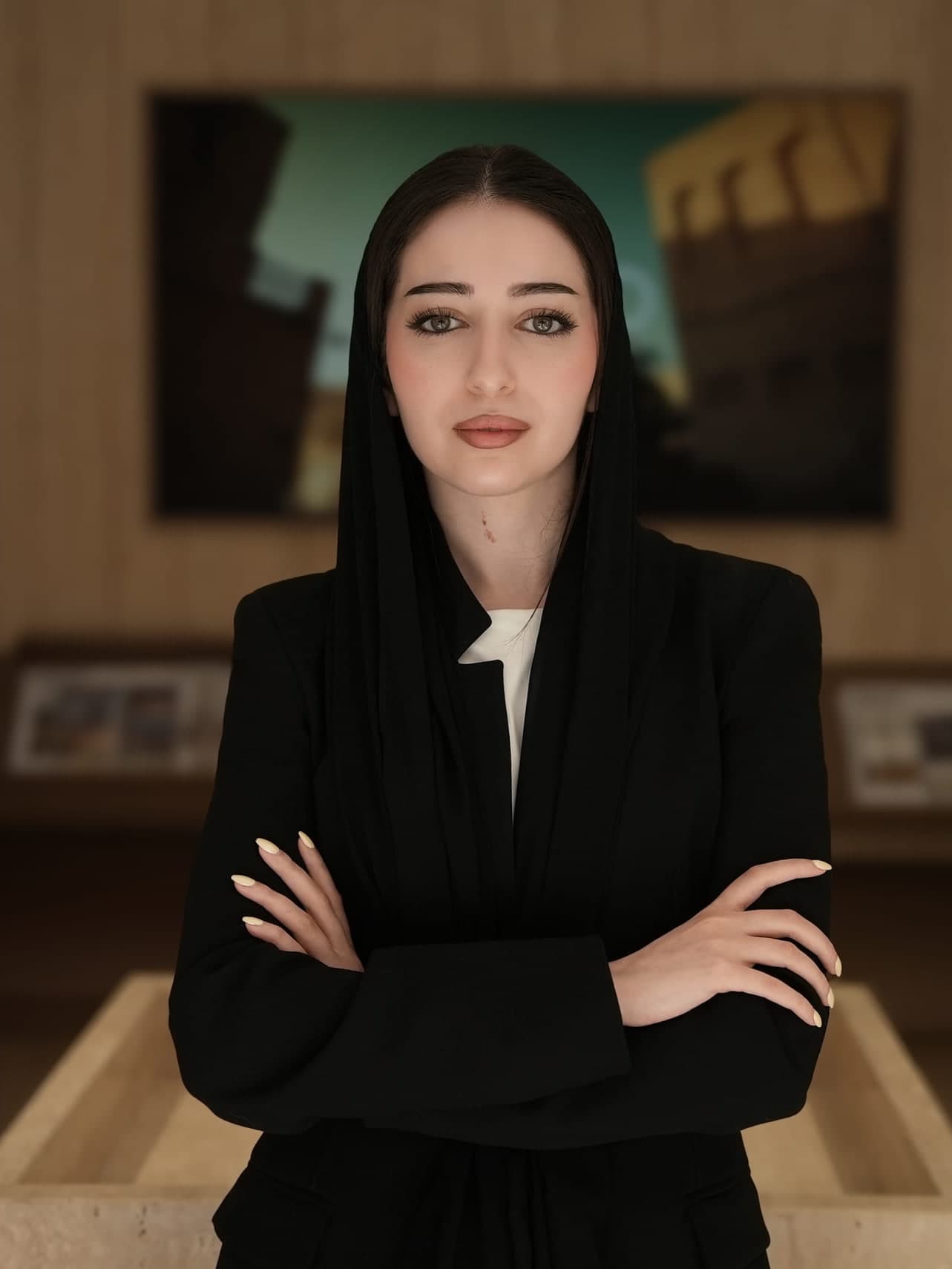 Mahra Al Ramlawi, Design Director of LKYOOB, arms folded in the studio