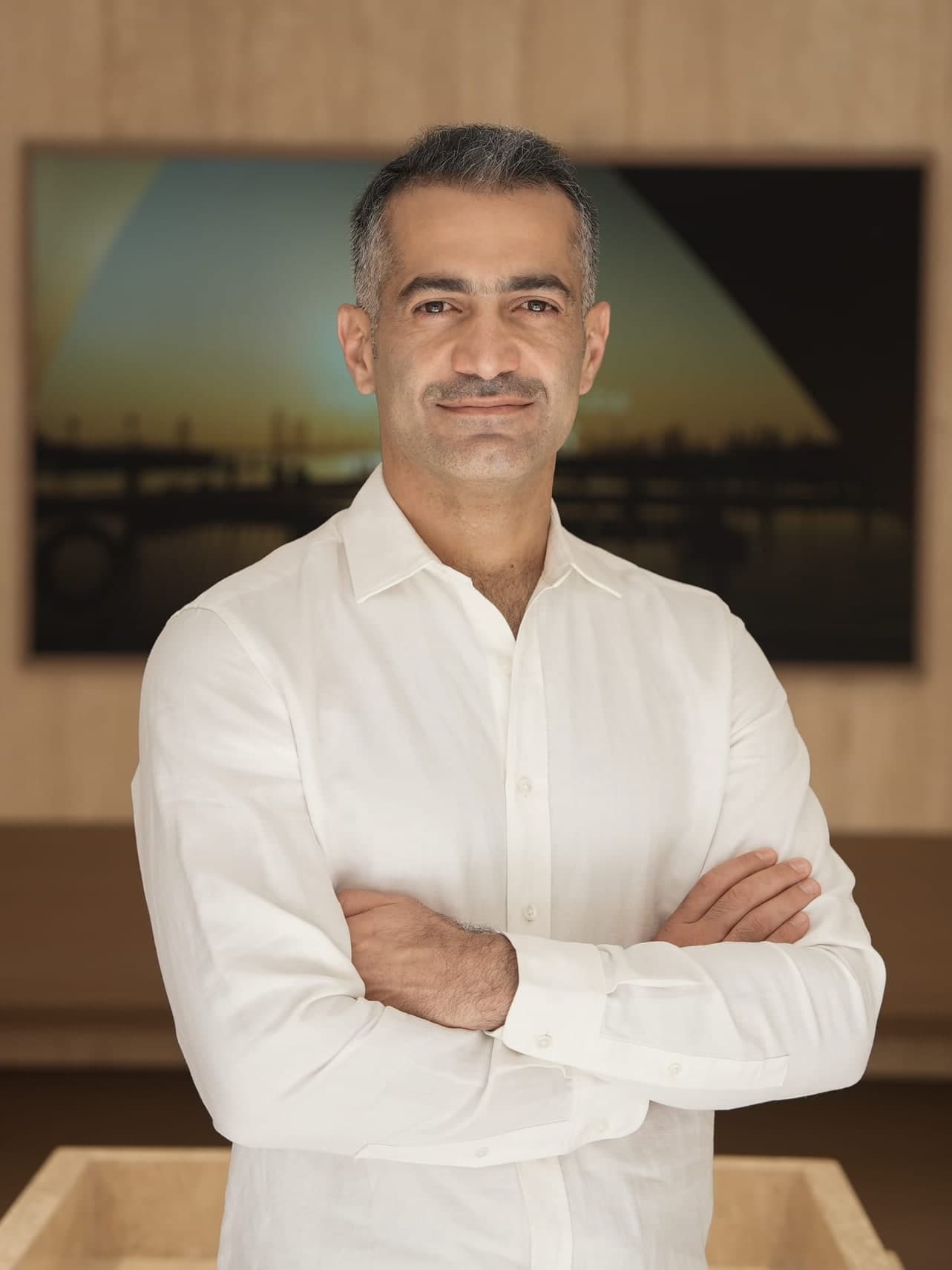 Moosa Swaidan, Founder and Chairman of LKYOOB, arms folded in the studio