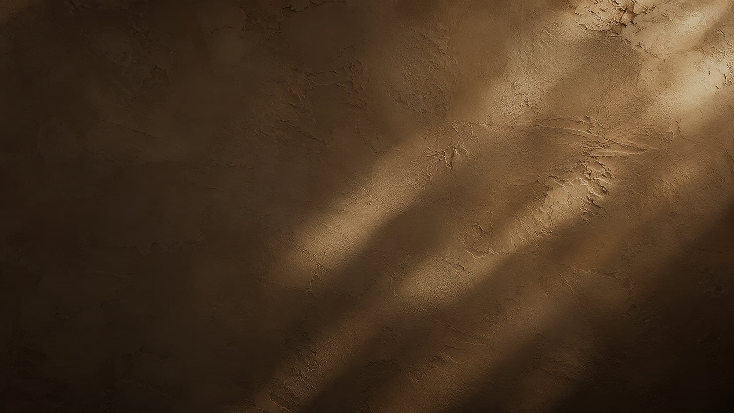 Plaster texture under warm raking light