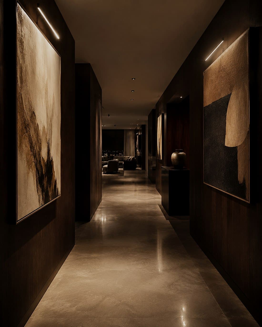 A gallery corridor in a penthouse hung with art