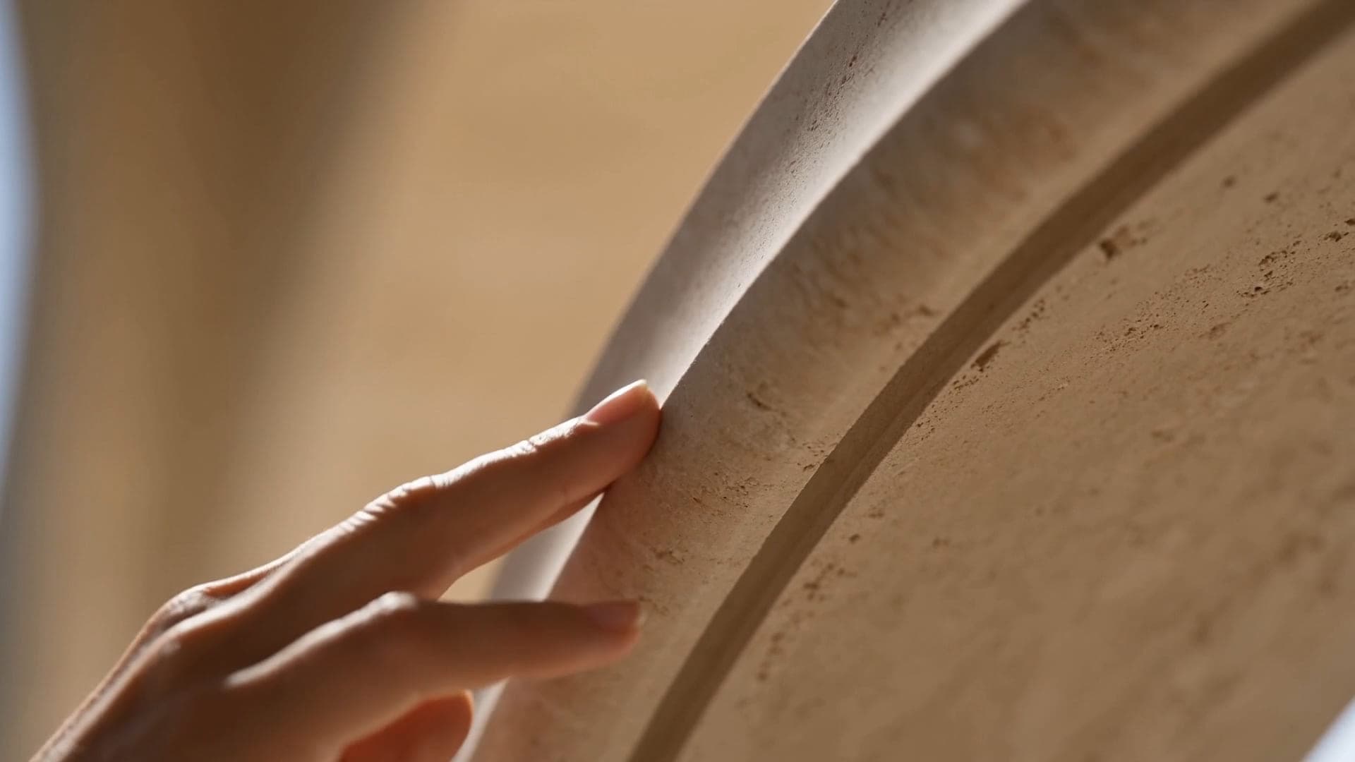 Design visualisation of a hand on the travertine edge of an arch, the stone drawn close up, by LKYOOB
