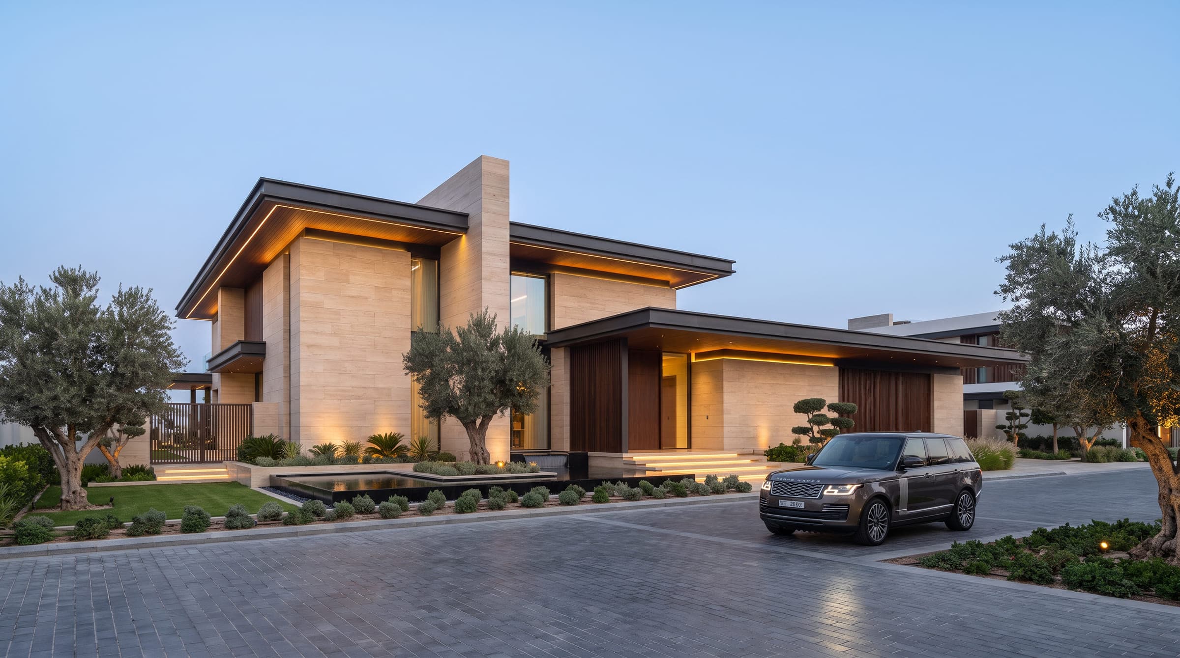 Design visualisation of the villa from the driveway at dusk, two travertine storeys under deep dark roofs, an olive tree and a car before the entrance, by LKYOOB